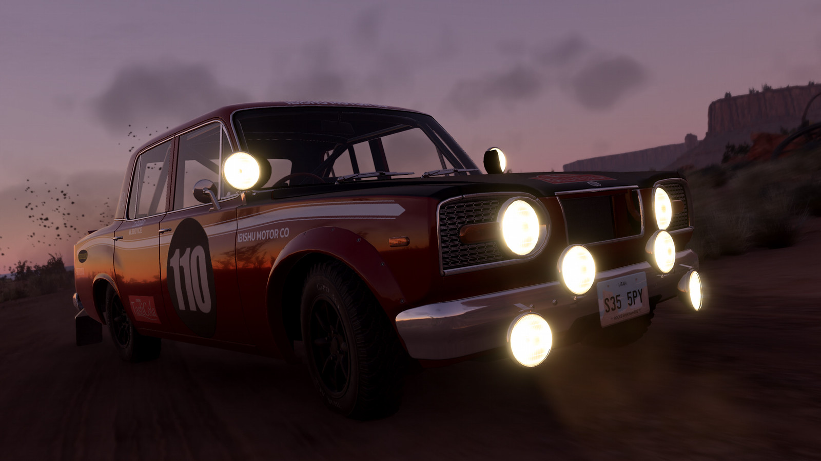 A BeamNG.drive vehicle kicks up dust during off-road driving.