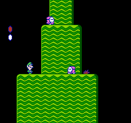 Mario lifts an object in the NES version of Super Mario Bros. 2.