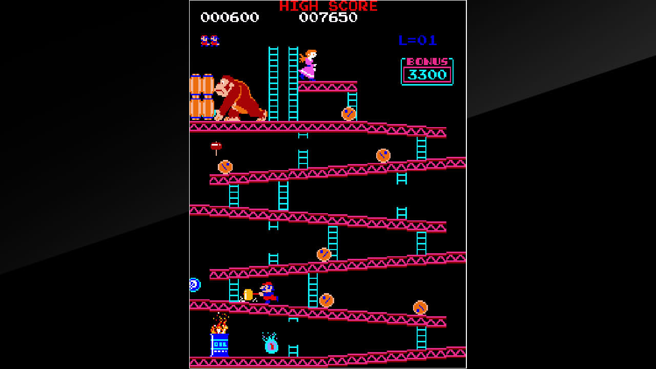 Mario jumps over barrels on the first Donkey Kong arcade stage