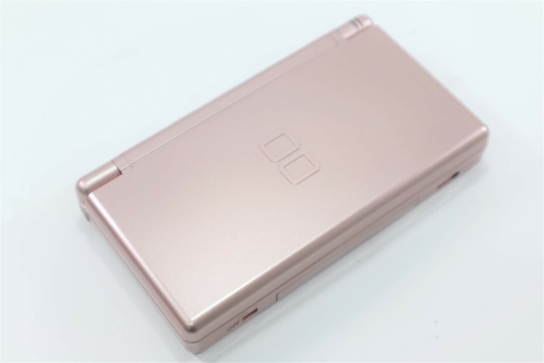 A closed pink Nintendo DS Lite photographed at an angle