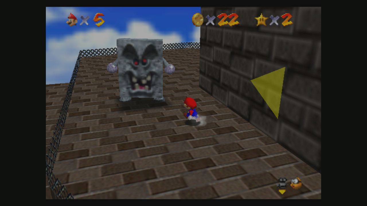 Mario explores a Super Mario 64 course with the Nintendo 64 camera behind him