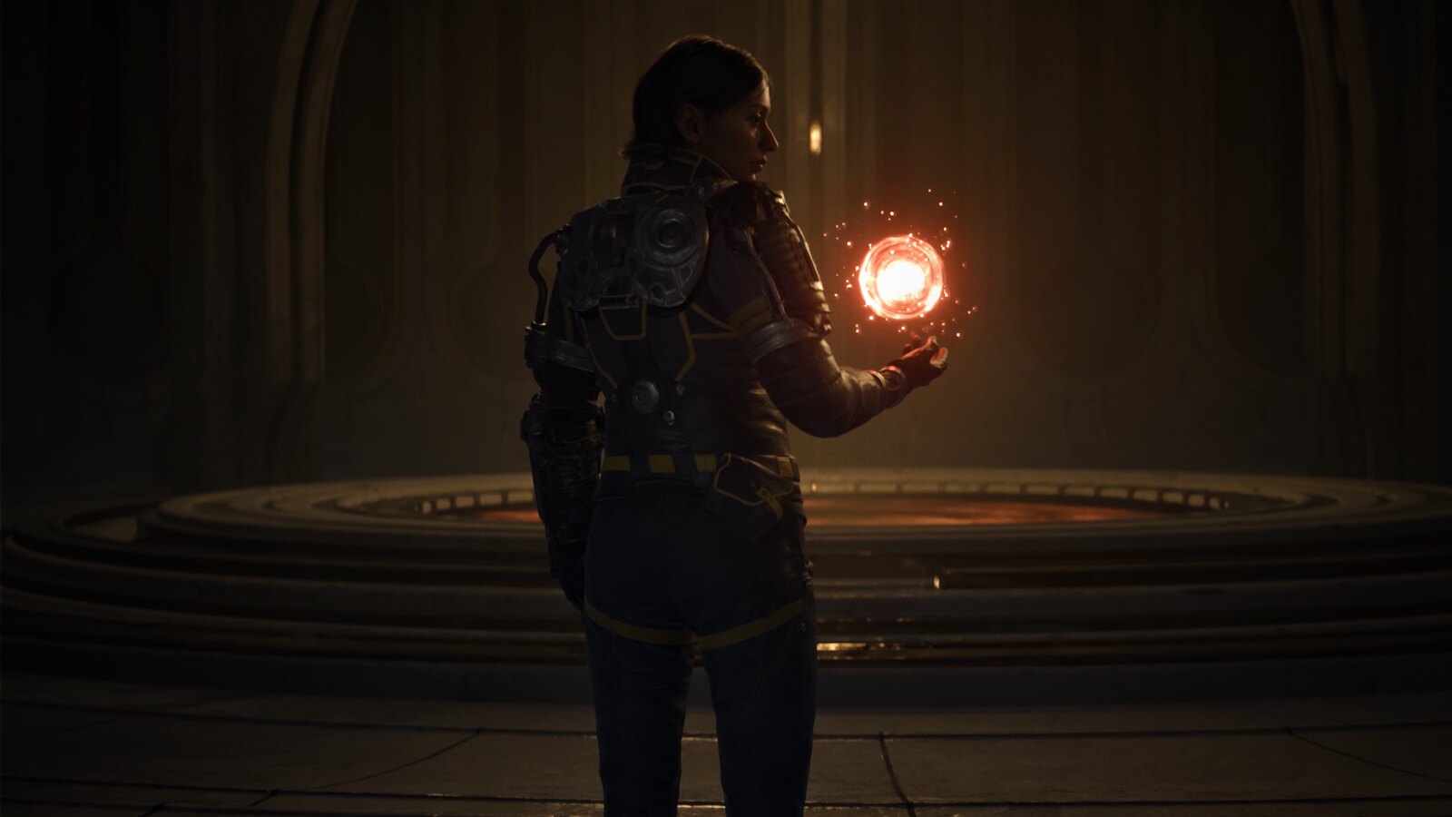 Arjun Devraj holding a glowing orange energy sphere in Saros